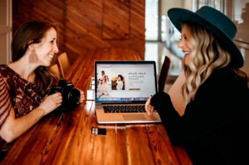 Collette Collabs meeting with a client with a laptop Collette Collabs meeting with a client with a laptop